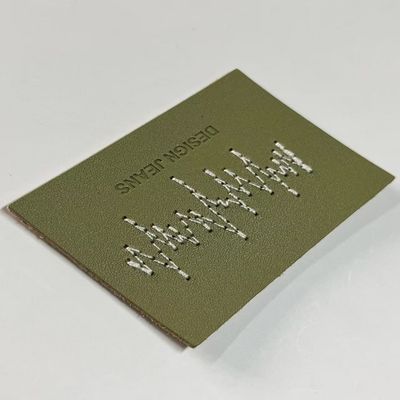Gepersonaliseerde groene spijkerbroeken Ledertekens Gebreide sluitingsvorm Voor kleding