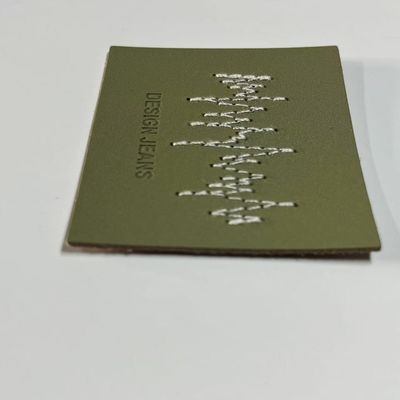 Gepersonaliseerde groene spijkerbroeken Ledertekens Gebreide sluitingsvorm Voor kleding